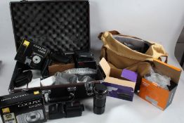 Camera accessories to include battery grips, Canon 200mm lens, Yongniu flash, camera bag, camera
