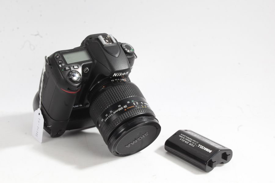 Nikon D80 camera with Nikon AF Nikkor 28-200mm 1:3.5-5.6D lens, with battery grip