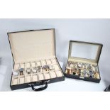 Watch box containing twelve fashion watches, attaché style watch case with recesses for twenty-