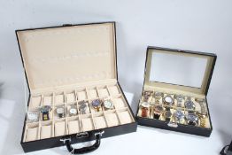 Watch box containing twelve fashion watches, attaché style watch case with recesses for twenty-