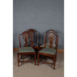 Set of four 19th century Hepplewhite vase back dining chairs, with an arched cresting rail above a