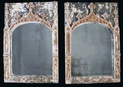 A pair of Gothic-style mirrors, possibly Italian, 18th century and later Each with an arched plate,