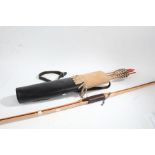 20th century long bow together with a quiver and arrows