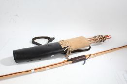 20th century long bow together with a quiver and arrows