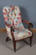 Victorian mahogany and upholstered nursing chair, having a floral button back and scroll arms raised