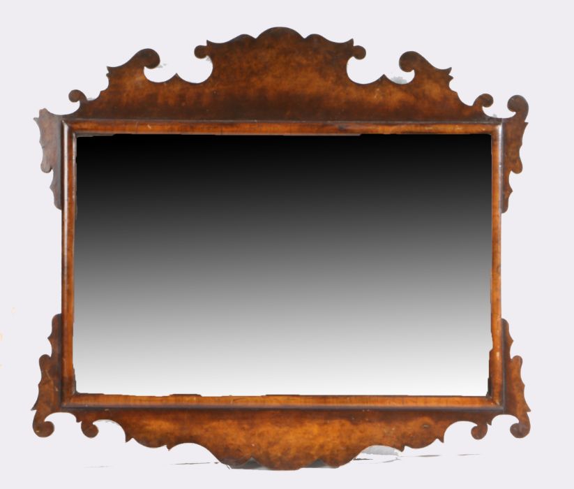George III style walnut wall mirror, with scroll fret frame surrounding the rectangular mirror