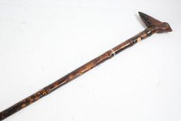 Chinese bamboo walking cane, the handle in the form of a bird, the shaft with leaf decoration,