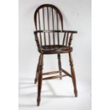20th century oak windsor childs chair, the arched back with turned splats and supports raised on