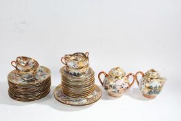 Japanese eggshell teaset, decorated with figures in landscapes on a gilt ground (qty)