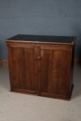 Victorian mahogany cupboard, the top inset with deep blue leatherette above a pair of panel doors