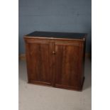 Victorian mahogany cupboard, the top inset with deep blue leatherette above a pair of panel doors