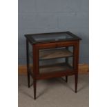 Edwardian Sheraton revival two tier bijouterie cabinet, the rectangular top with crossbanding