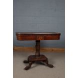 Early 19th century mahogany and brass inlaid fold over card table, the top decorated with brass