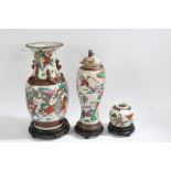 Two 20th century Chinese crackle glazed vases, each painted with warriors in battle, the tallest