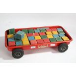 Tri-ang tinplate wagon, with wooden building blocks, 52cm long