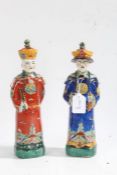 Two Chinese porcelain Emperor figures, each with brightly painted clothing, 27cm tall (2)