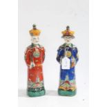 Two Chinese porcelain Emperor figures, each with brightly painted clothing, 27cm tall (2)