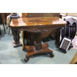 William IV rosewood card table, the swivel top opening to reveal a red baize interior above a floral