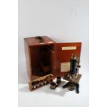 Early 20th century W. Watson & Sons Ltd cased microscope, No 65547, with a black and brass