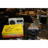 Yashica Electro 35 FC camera, together with a Power Solid State Wireless Transistorized Intercom,