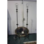 Two iron standard lamps and a hanging wall mirror, (3)