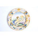 18th Century Italian maiolica plate, Castelli, the central ground with depiction of two cherubs