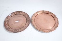 Two Art Nouveau copper dishes/plates, all with floral edges, the largest 32cm diameter