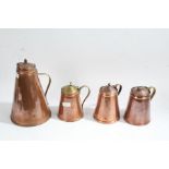 Four Victorian and later copper jugs/ewers, all with tapering bodys, largest 27cm high