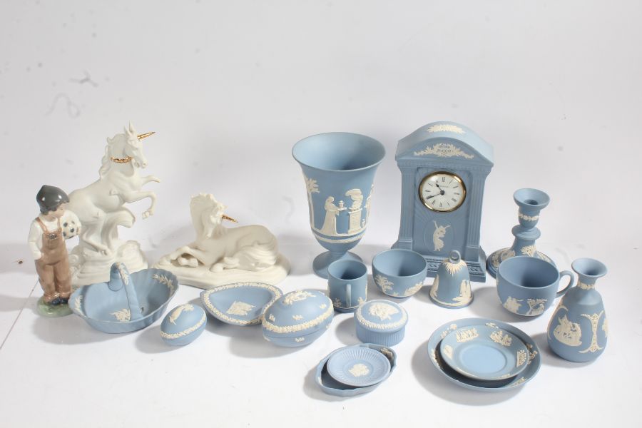 Large collection of Wedgwood blue jasperware to include mantle clock, candlestick, cups etc together