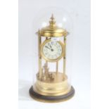 Large brass anniversary clock, the dial with arabic numerals and floral garlands, raised on six