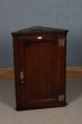 19th century mahogany hanging corner cupboard, with a single panel door opening to reveal two