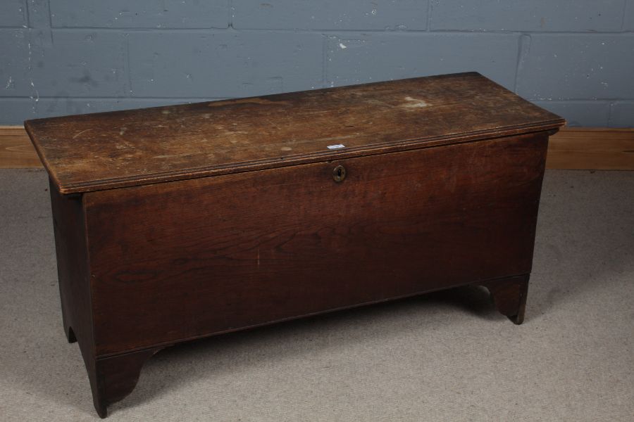 19th century elm coffer, the rectangular top opening to reveal a candle box set on cut away ends,