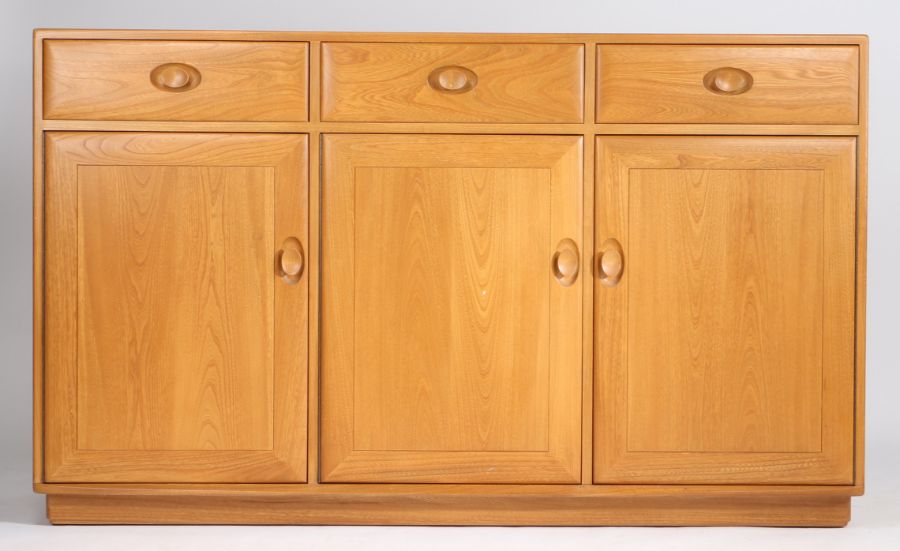 Blonde Ercol sideboard, fitted three drawers above three cupboard doors, 155cm long, 94cm high, 43.