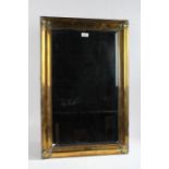 Rectangular brass framed wall mirror, with bevelled glass plate, 71cm long, 46cm wide