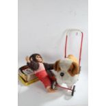 Push-a-long toy dog on wheels, together with a monkey soft toy, a Little Miss Washday Set and a