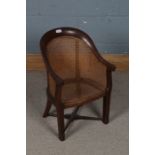 Victorian mahogany and cane child's chair, with a arched back and a cane back and seat raised on