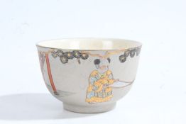 Japanese porcelain tea bowl, with two figures in gilt robes, stamped to base 6cm diameter