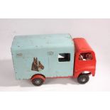 Tri-ang tinplate horse box, in light blue and red, containing two horse46.5cm long