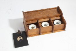 Victorian oak inkwell, with three sliding compartments housing the wells, 22cm wide, portrait