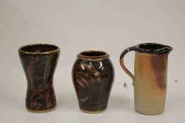 Two Muchelney Pottery vases with geometric wax resist decoration, 17cm and 15.5cm high, Muchelney