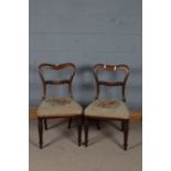 Pair of 19th century chairs, the wavy cresting rail above a scroll carve splat, set on a floral