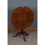 George III mahogany occasional table, the circular top above the turned column and three cabriole