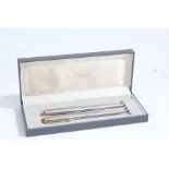 Parker stainless steel pen and pencil, housed within a Parker box