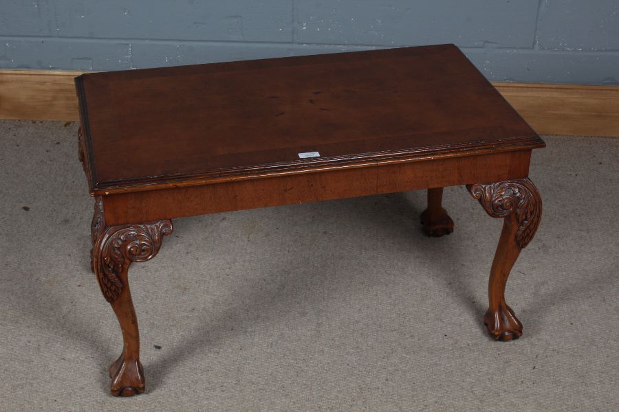 20th century walnut and mahogany coffee table, the rectangular walnut top with mahogany cross