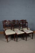 A set of four Edwardian mahogany dining chairs, together with a Victorian Rosewood balloon back