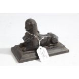 20th century bronzed metal sculpture depicting a sphinx set on a plinth base, 16.5cm long 12cm