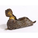 Art Nouveau style cold painted bronze depicting a reclining scantily clad lady enclosed by a
