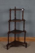 Victorian four-tier mahogany whatnot, with shaped tiers and spiral turned supports raised on