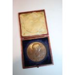 Queen Victoria commemorative medallion housed within red leather clad box