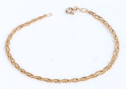 9 carat gold bracelet formed of interwoven strands, stamped 375, weight 1.5